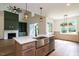 Kitchen featuring a kitchen island with a sink, stainless steel appliances and stylish lighting at 20 Tamaran Ct, Spring Hope, NC 27882