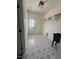 Functional laundry room with patterned floors, sink, built-in shelving, and natural light at 20 Tamaran Ct, Spring Hope, NC 27882