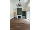 Living room showcasing a fireplace, built-in shelving, and hardwood floors at 20 Tamaran Ct, Spring Hope, NC 27882