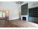 Spacious living room features hardwood floors, fireplace, and custom built-in shelving at 20 Tamaran Ct, Spring Hope, NC 27882