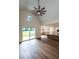 Open-concept living area featuring hardwood floors, vaulted ceilings, and kitchen view at 20 Tamaran Ct, Spring Hope, NC 27882