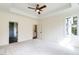 Bright main bedroom with carpet, ceiling fan, and views to the backyard at 20 Tamaran Ct, Spring Hope, NC 27882