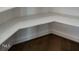 A look inside the pantry with custom white shelving and hardwood floors at 20 Tamaran Ct, Spring Hope, NC 27882