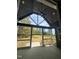 Relaxing outdoor patio with a vaulted ceiling, ceiling fan, and views of a lush backyard and wooded area at 20 Tamaran Ct, Spring Hope, NC 27882