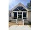 Covered patio with white railings and stairs at 20 Tamaran Ct, Spring Hope, NC 27882