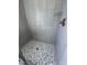 Tiled shower with hexagon floor and glass shelf at 20 Tamaran Ct, Spring Hope, NC 27882