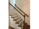 The staircase features stained wood steps and white railings at 20 Tamaran Ct, Spring Hope, NC 27882