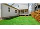 A spacious, freshly cut backyard with newly planted landscaping, and a view of the house at 224 Wash Hollow Dr, Wendell, NC 27591