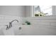 A close up of the soaking tub with tile surround in the primary bathroom at 224 Wash Hollow Dr, Wendell, NC 27591