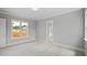 Spacious bedroom featuring carpet floors, natural light, and a doorway to the bathroom at 224 Wash Hollow Dr, Wendell, NC 27591