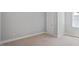Bedroom with neutral walls, carpet and white trim and a window at 224 Wash Hollow Dr, Wendell, NC 27591