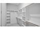 Well-organized walk-in closet with custom shelving, perfect for storage and organization at 224 Wash Hollow Dr, Wendell, NC 27591