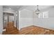 Spacious dining area with hardwood floors, modern lighting and ample room for entertaining at 224 Wash Hollow Dr, Wendell, NC 27591