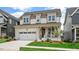 Beautiful two-story home, featuring a manicured lawn and a welcoming front porch at 224 Wash Hollow Dr, Wendell, NC 27591
