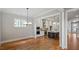 Modern kitchen featuring a dark wood island and stainless appliances, open to dining area at 224 Wash Hollow Dr, Wendell, NC 27591