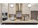Kitchen island with quartz countertop, bar seating, and stainless steel appliances at 224 Wash Hollow Dr, Wendell, NC 27591