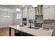 Spacious kitchen island with pendant lighting and stainless appliances, open to the living room at 224 Wash Hollow Dr, Wendell, NC 27591
