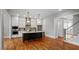 Stylish kitchen with stainless steel appliances, a kitchen island, and hardwood floors at 224 Wash Hollow Dr, Wendell, NC 27591