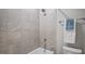Close up on tiled shower and tub combination in bathroom, with fresh towels nearby at 224 Wash Hollow Dr, Wendell, NC 27591