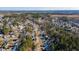 High-angle aerial showcases the layout of this planned community with mature trees and winding roads at 2773 Clifton Avenue, Creedmoor, NC 27522