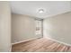 Simple bedroom with hardwood floors and a large window at 2773 Clifton Avenue, Creedmoor, NC 27522