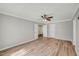 Large bedroom with hardwood floors and multiple doors at 2773 Clifton Avenue, Creedmoor, NC 27522