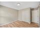 Well-lit bedroom with hardwood floors and double closet at 2773 Clifton Avenue, Creedmoor, NC 27522