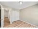 Simple bedroom with hardwood floors and double door closet at 2773 Clifton Avenue, Creedmoor, NC 27522