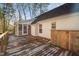 View of deck with wooden privacy screen and house exterior at 2773 Clifton Avenue, Creedmoor, NC 27522