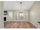 Spacious dining area with hardwood floors, chandelier, and access to backyard at 2773 Clifton Avenue, Creedmoor, NC 27522
