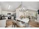 Kitchen and dining area with hardwood floors, chandelier, and view of living room at 2773 Clifton Avenue, Creedmoor, NC 27522