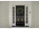 Black front door accented with a stylish eucalyptus wreath at 2773 Clifton Avenue, Creedmoor, NC 27522