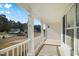 Covered porch with white railings and a view of the neighborhood at 2773 Clifton Avenue, Creedmoor, NC 27522