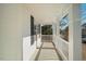 White front porch with white railings offering a view of the street and neighborhood at 2773 Clifton Avenue, Creedmoor, NC 27522