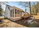 Rear view of house, showcasing screened porch and deck at 2773 Clifton Avenue, Creedmoor, NC 27522