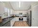 Modern kitchen with stainless steel appliances and white cabinets at 2773 Clifton Avenue, Creedmoor, NC 27522