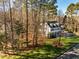 Aerial view of home showcasing backyard and trees at 3 Acornridge Ct, Durham, NC 27707