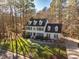 Aerial view of two-story home, driveway and yard at 3 Acornridge Ct, Durham, NC 27707