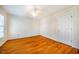 Simple bedroom with hardwood floors and ceiling fan at 3 Acornridge Ct, Durham, NC 27707