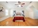 Bright bedroom with hardwood floors, large windows and ceiling fan at 3 Acornridge Ct, Durham, NC 27707