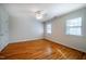 Well-lit bedroom with hardwood floors and ceiling fan at 3 Acornridge Ct, Durham, NC 27707