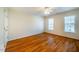 Spacious bedroom with hardwood floors and large windows at 3 Acornridge Ct, Durham, NC 27707