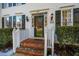 Front entrance with brick steps, green door and white railings at 3 Acornridge Ct, Durham, NC 27707