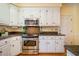 Modern kitchen with stainless steel appliances and ample cabinet space at 3 Acornridge Ct, Durham, NC 27707
