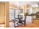 Bright eat-in kitchen with hardwood floors and access to backyard patio at 3 Acornridge Ct, Durham, NC 27707