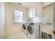 Laundry room with washer, dryer, and additional cabinets at 3 Acornridge Ct, Durham, NC 27707