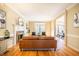 Living room with a fireplace, hardwood floors, and a leather couch at 3 Acornridge Ct, Durham, NC 27707
