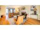 Bright living room features hardwood floors, a fireplace, and ample natural light at 3 Acornridge Ct, Durham, NC 27707