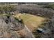 Expansive aerial view of the property including home, pool, outbuildings, and surrounding land at 413 Johnson Town Rd, Zebulon, NC 27597