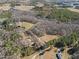 Aerial view of property showcasing expansive land and nearby lake at 413 Johnson Town Rd, Zebulon, NC 27597
